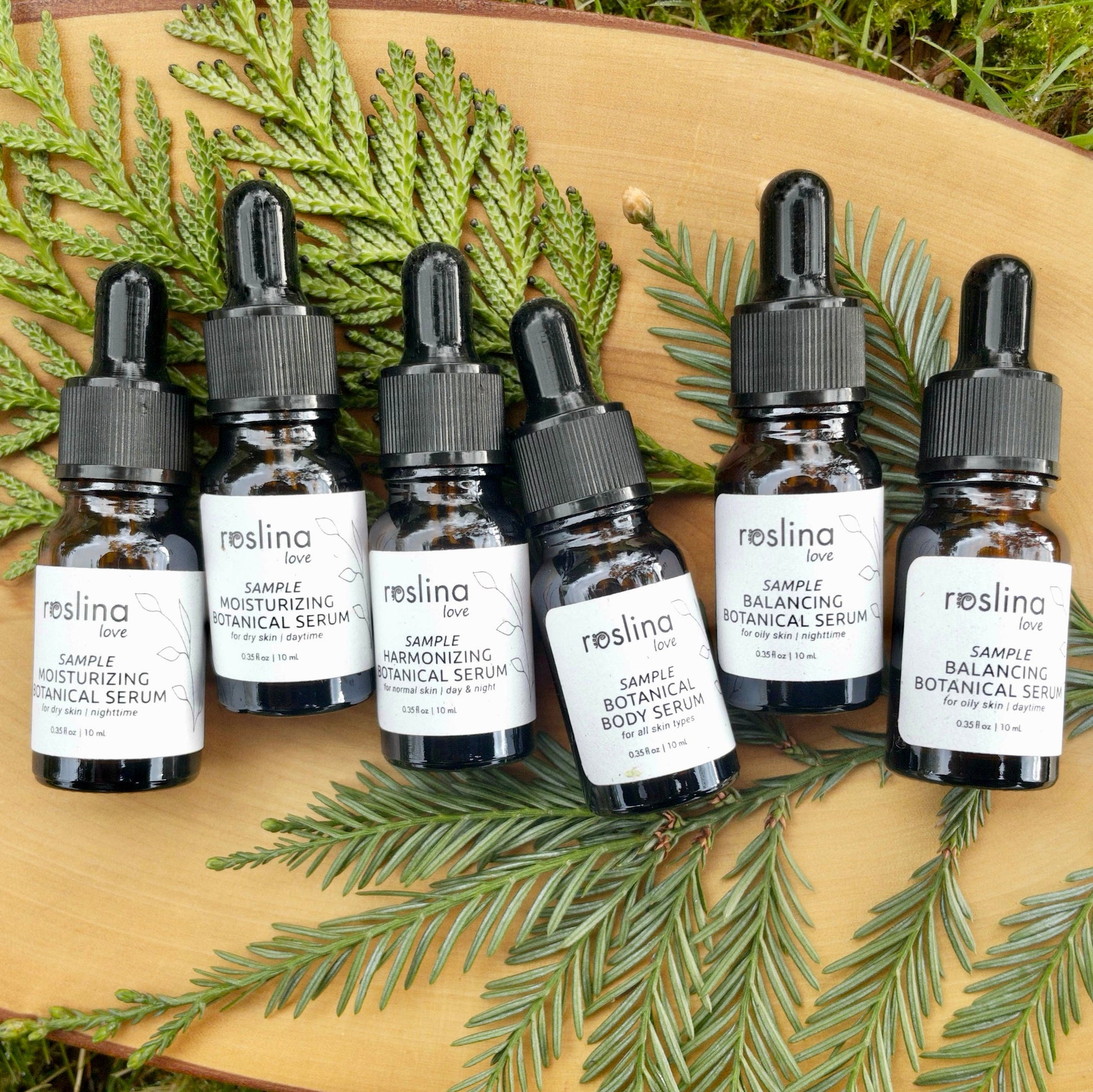 Collage of all roslina love skincare serums: (1) Harmonizing botanical serum for normal‑to‑combination skin, usable day & night; (2) Organic facial moisturizing serum with botanical oils, moisturizing duo; (3) Lightweight body serum that absorbs quickly, leaving skin smooth and moisturized